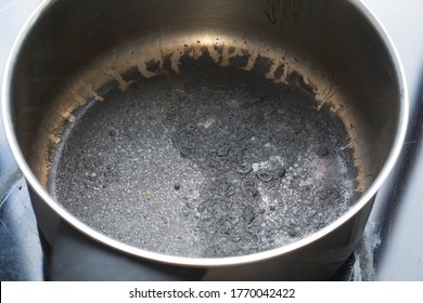 Empty Burnt Pot With Black Bottom