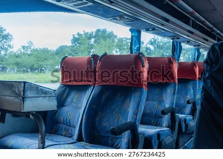 An empty bus interior. The seats on a comfortable travel bus.