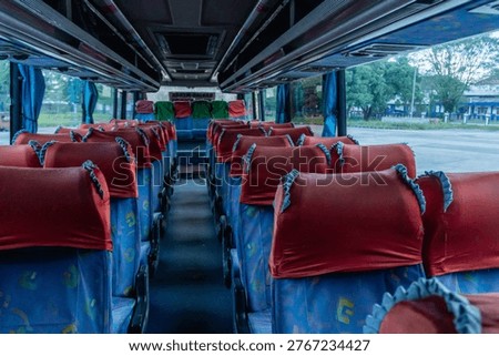 An empty bus interior. The seats on a comfortable travel bus.