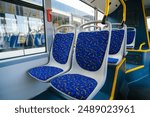 Empty bus interior. Seats without passengers. Public transport. Transportation of passengers by public transport. Ergonomic interior of the bus. Travel to other cities.