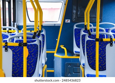 Empty bus interior. Seats without passengers. Public transport. Transportation of passengers by public transport. Ergonomic interior of the bus. Travel to other cities. - Powered by Shutterstock