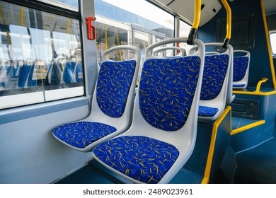 Empty bus interior. Seats without passengers. Public transport. Transportation of passengers by public transport. Ergonomic interior of the bus. Travel to other cities. - Powered by Shutterstock