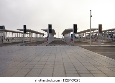 Empty bus station with platforms 5 to 8 airport terminals 24 hours a day. Early morning with nobody around. Blank tiled ground with copy space for your text, information or advertising content