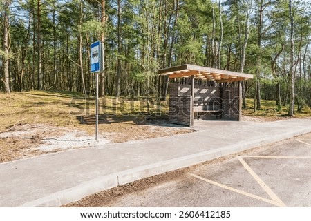 Empty bus stop in the forest.