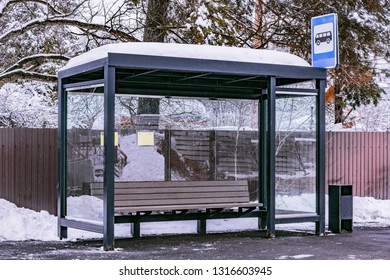 Empty bus stop at winter day time.