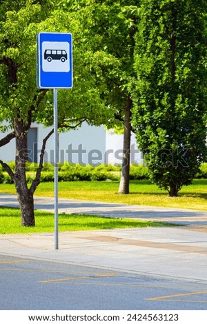empty bus stop without people, vertical image. bus stop sign