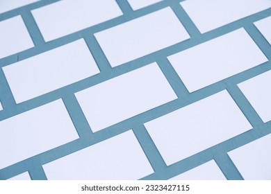 A lot of empty business cards on a blue background