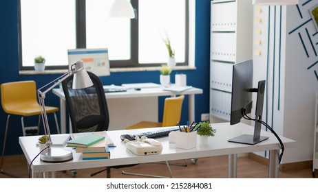 Empty Business Office With Startup Technology For Economy Work, Used By Employee To Create Commercial Strategy With Graphs And Charts. No People Working In Professional Startup Workspace.