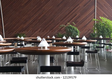 empty cafe interior with tables on the lamps