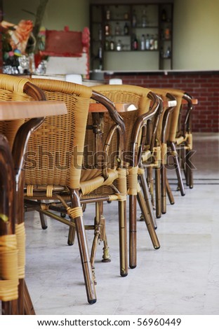 Empty cafe interior with wooden tables and chairs