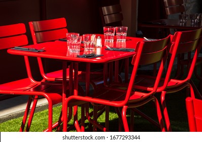 Empty Cafe Outdoor Terrace Setting For Lunch In Sunny Day. Nobody. Abandoned Lifestyle Background. Impossible Dinner Party, Socializing Limits Metaphor, Economic Crisis Concepts.