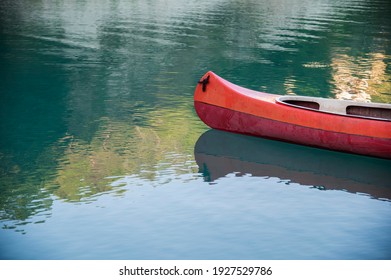 Empty Canoe On The Shore Of Alpine Lake