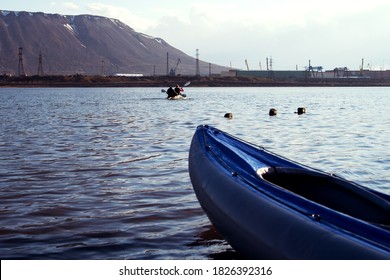 Empty Canoe At Sunset. Canoe On The Shore Of Long Lake In Norilsk