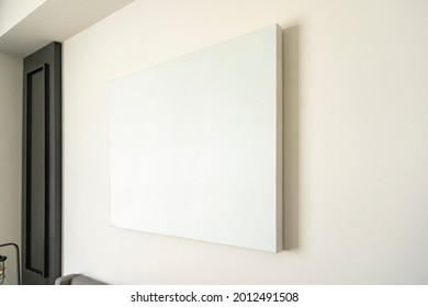 Empty Canvas, Poster, Blank Frame Canvas, Mock Up, On A White Wall, Living Room, Home Decoration Template, Angle View