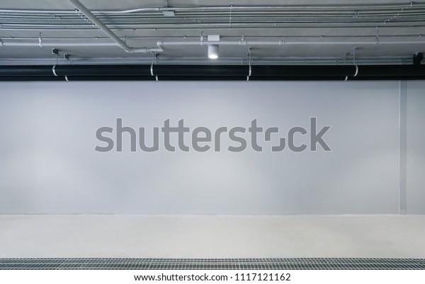 Empty Car\
garage wall background with copy space, interior underground\
parking of department store with spotlight\
show