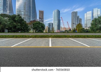 Empty Car Park With Downtown City Space Background