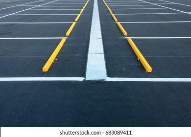 Empty Car Parking Lot And Asphalt Slab Pavement, City Vehicle Outdoors Park With Allocate Area Strip Line Painting. Public Parking On Concrete Asphaltic Paving And Storm Drainage Gutter