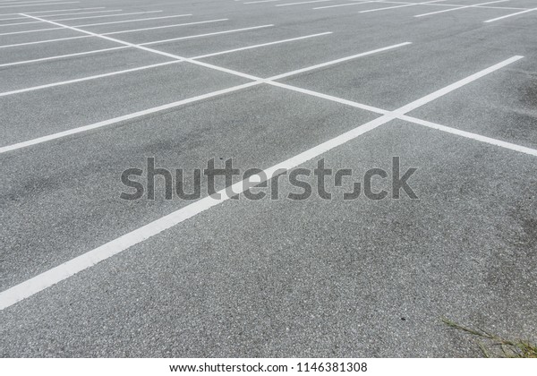 Empty car parking lot at\
city center, Vacant Parking Lot, Parking lane painting on floor,\
copy space