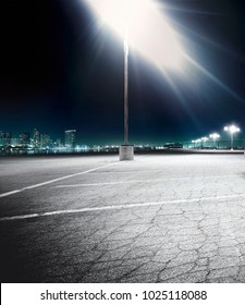 Empty Car Parking Lot Lit Up At Night Time