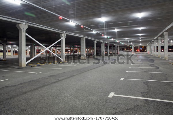 Empty car Parking in the shopping center during\
pandemic. People avoid public places and stay at home. The concept\
of pandemic, epidemic,\
covid-19.
