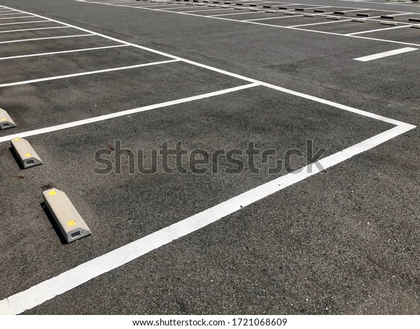 Empty car parking with white\
line parking lot. Outdoor asphalt parking lot.Tarmac surface\
driveway.