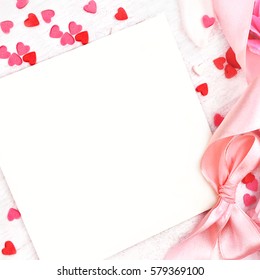 Empty card copy space on pastel pink valentine decor background, soft heart frame, toned
