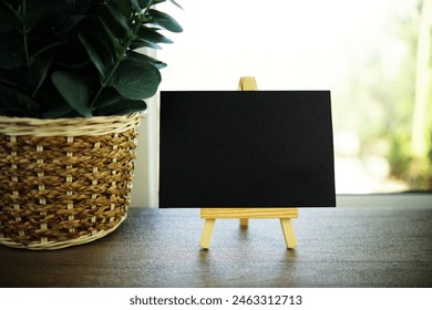 Empty card space for text message with wooden easel
