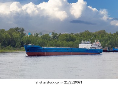 An empty cargo barge on the Yenisey river in Siberia, Russia. Barge is a flat-bottomed boat for river and canal transport of bulk goods - Shutterstock ID 2172529091