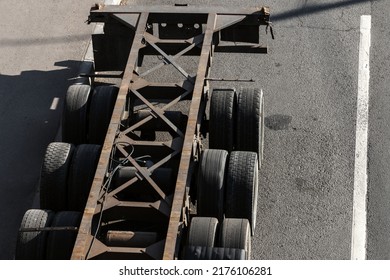 An Empty Cargo Truck Parked On An Urban Asphalt Road, Aerial View