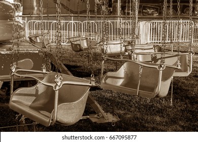 Empty Carnival Ride Children's Chairs Sepia