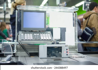 Empty cash desk with computer terminal in supermarket - Shutterstock ID 244388497