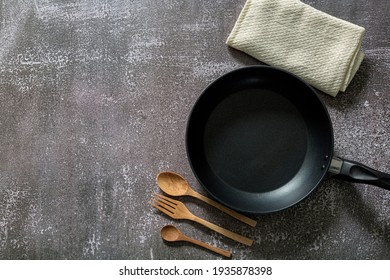 Empty Cast Iron Frying Pan On Dark Grey Culinary Background, View From Above