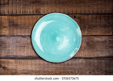 Empty Ceramic Blue Plate On Wood Table