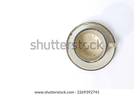 Empty ceramic cup handmade japanese on white background.
ฺBlank hot cup pottery chinese traditional.
top view.
