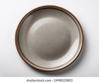 Empty ceramic round plate isolated on white background. View from above.