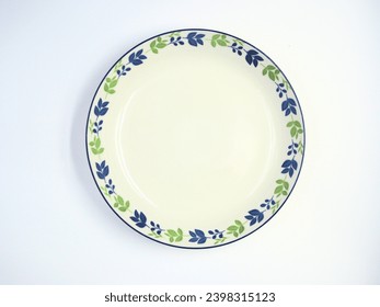 Empty ceramic round plate on top view isolated on white background,Ceramic plate with leaf pattern - Powered by Shutterstock