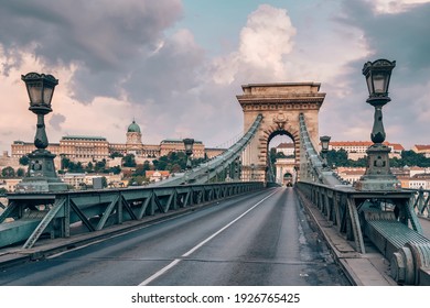 Empty Chain bridge on Danube river at sunrise in Budapest, Hungary