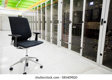 Empty chair in corridor of server room - Powered by Shutterstock