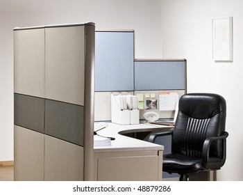 Empty Chair At Desk In Cubicle