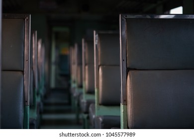 Empty chair inside of old train.