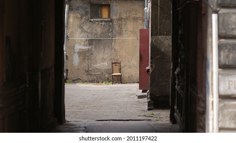 An Empty Chair In The Middle Of Old Wartorn City.