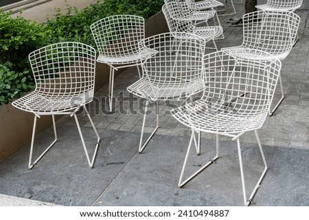 Empty chair seat outdoor. Cafe chair with nobody. Empty seat furniture. Chair or deckchair for cafe visitors