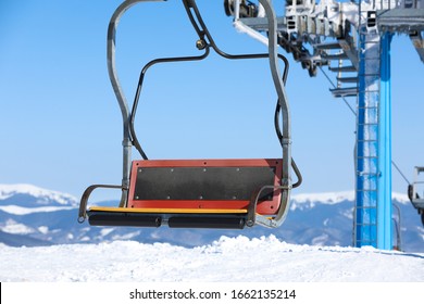 Empty Chairlift At Mountain Ski Resort. Winter Vacation