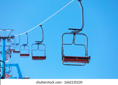 Empty chairlift at mountain ski resort. Winter vacation - Powered by Shutterstock