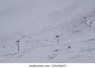 Empty Chairlift In Snowy Mountain Ski Resort