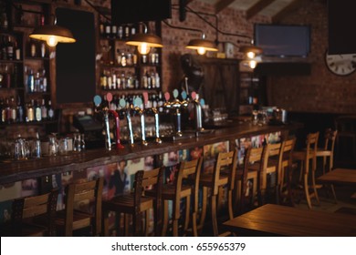 Empty Chairs Arranged In Pub