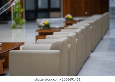 empty chairs arrayed in neat, orderly rows, suggesting anticipation for an upcoming event or gathering in a large venue.
