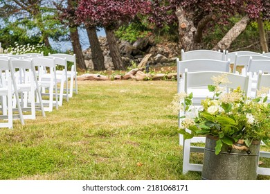 Empty Chairs Before An Outdoor Wedding Celebration