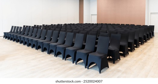 Empty chairs in a conference room waiting for guests and speakers at a business event at the hotel - Powered by Shutterstock