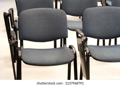 Empty Chairs With Foldable Desks At A Lecture Hall, Vacant Course, Seminar Room, Class, Business School, Nobody, Empty Seats, No People At The University Abstract Concept, Interior Detail, Closeup